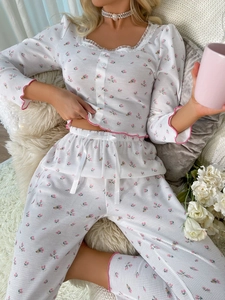 Detail of floral waffle knit pajama set with pink lettuce edge and bow drawstring