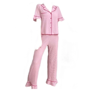 Pink short sleeve pajamas set with contrast piping and ruffled edges for women