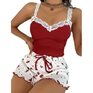 Women's pajama set featuring red ribbed lace camisole and white floral print shorts