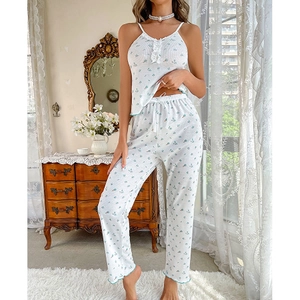 Floral pajama set with camisole and pants featuring blue prints and lace trim