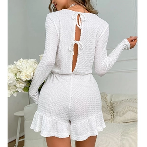 White waffle knit long sleeve romper for women with open back and bow tie details