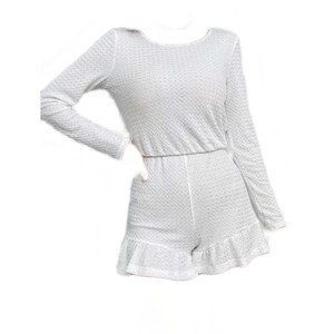 White long-sleeve waffle knit romper for women with ruffled hem and elastic waist