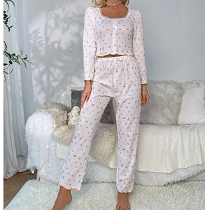Detailed close-up of floral square neck pajama set with lace trim and ruffled edges