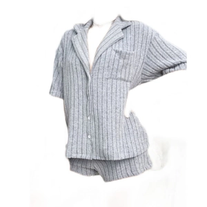 Women's grey ribbed knit pajama set with short sleeve button-up shirt and shorts