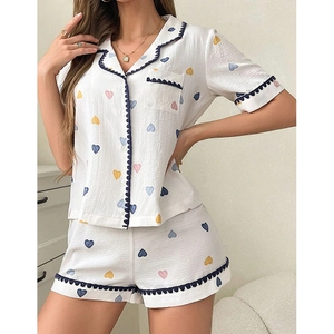Women's pajama set with colorful heart prints, short sleeve shirt and shorts with wavy trim