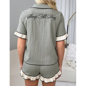 Women's green seersucker pajama set with lace trim and Sleep All Day embroidery