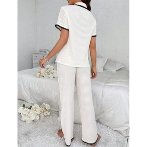 Short-sleeve women's summer pajamas set in cream white with black lace trim edges