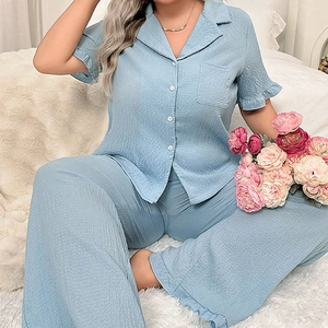 Women's plus size light blue short sleeve pajama set with ruffled hem and textured fabric