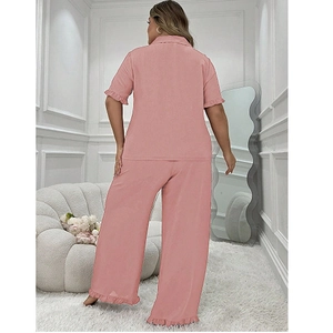 Rear view of pink two-piece pajamas set featuring ruffled short sleeves and wide-leg pants