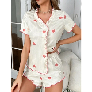 Women's two-piece heart print pajama set with lettuce edge trim and short sleeves