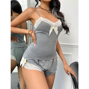 Grey two-piece pajamas set with white lace trim and bow details for women