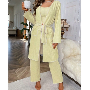 Three-piece pale yellow waffle lounge set with tank top, pants and piped robe