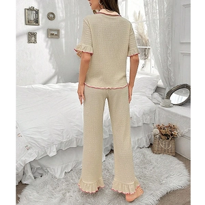 Women's 2-piece beige loungewear set with short sleeves, pants and pink ruffled edges