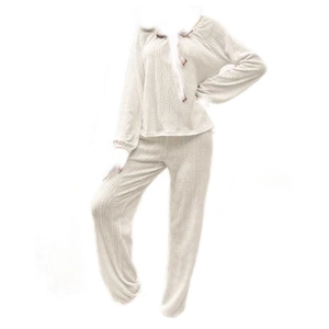 Sweet beige two-piece lounge set with bow details and textured knit fabric
