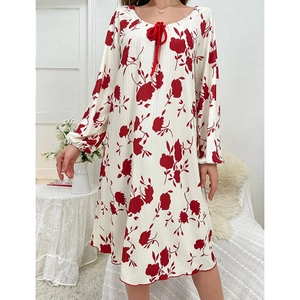 Detail of round neckline with red drawstring and wavy hem on floral lounge dress