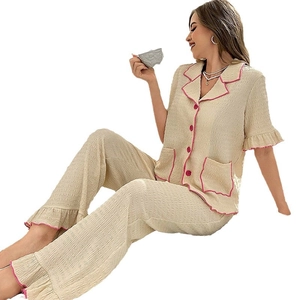 Women's 2-piece seersucker pajama set with pink ruffled edges and button-down shirt