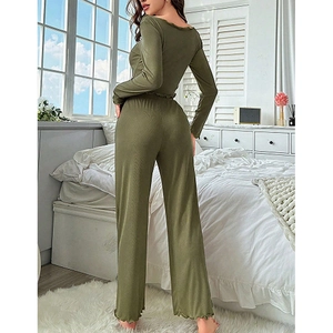 Detailed view of olive green ribbed knit pajama set with elegant ruffle trim edges
