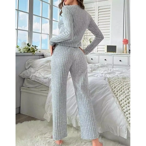 Women's light grey ribbed knit lounge set featuring long sleeve top and wide leg pants
