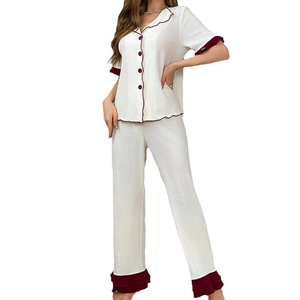 Women's pajama set featuring short sleeve button top and pants with burgundy wave trim
