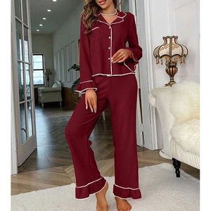 Elegant burgundy long-sleeve pajama set with white piping and ruffle details on cuffs