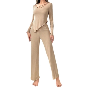 Women's rib-knit lounge set featuring an asymmetric long sleeve top and flared pants