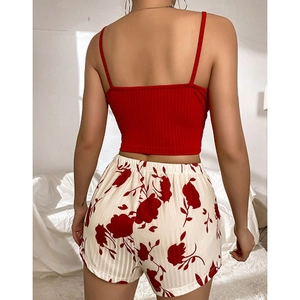Women's summer pajama set featuring a red ribbed tank top and floral printed shorts