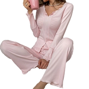 Women's light pink V-neck ribbed pajama set with lettuce trim and wide-leg pants