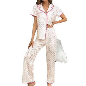Women's summer pajama set featuring heart print short sleeves and trousers with pink scalloped trim