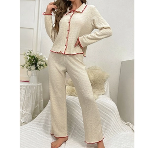 Women's cream white long sleeve pajama set with red lettuce edge and textured fabric