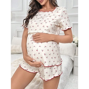 Women's maternity pajamas set with cherry print and red ruffled edges in soft cream fabric