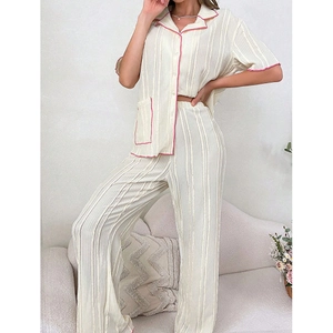 Women's two-piece short sleeve pajama set in cream with pink contrast piping detail