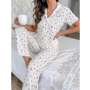 Women's pajama set featuring short sleeve lapel top and pants with red tulip print