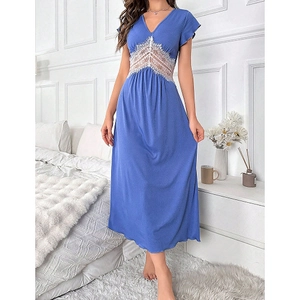 Detail of elegant V-neck light blue nightgown with delicate white lace patchwork waist