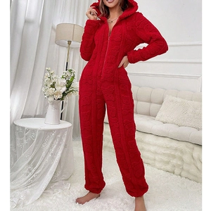 Detail of red hooded plush onesie with embossed bear pattern and zipper closure