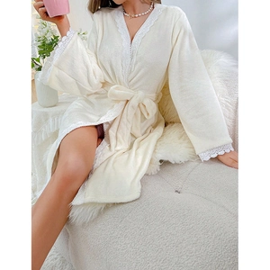 Elegant cream coral fleece long-sleeve bathrobe with delicate white lace trim and waist tie