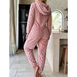 Women's pink coral fleece hooded jumpsuit in cable knit texture for winter warmth