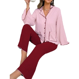 Pink and deep red long-sleeved waffle knit pajama set for women featuring contrast piping