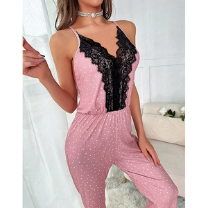 Pink polka dot v-neck jumpsuit with black lace trim and adjustable spaghetti straps