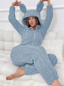 Detail of light blue fleece jumpsuit with 3D bunny ears hood and embossed bear texture