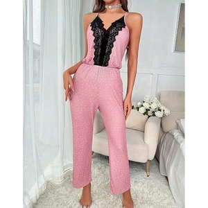 Pink polka dot romper loungewear with elegant black lace V-neck and spaghetti straps
