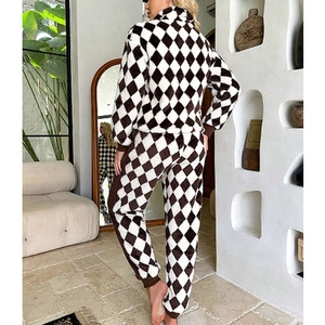 Women's warm flannel pajama set featuring stylish black and white plaid patterns