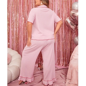 Women's plus size pink short sleeve pajama set with ruffle trim and wide leg pants