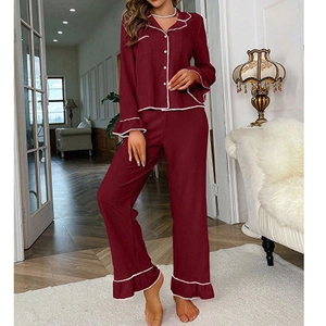 Women's burgundy waffle knit pajama set with long sleeves and elegant ruffle details