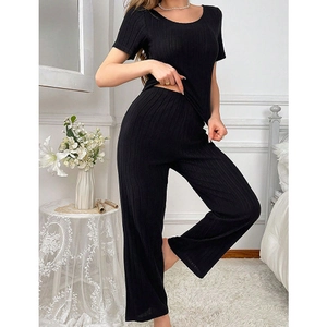 Women's black ribbed loungewear set with short sleeve top and wide leg pants