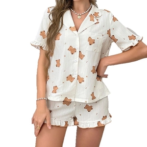 Women's cream short sleeve bear print pajama set with lapel top and ruffled shorts