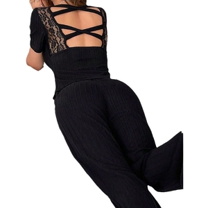 Women's backless short sleeve pajama set with lace details and ribbed pants in black
