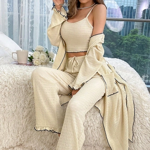 Three-piece beige lounge set with tank top, cardigan and wide-leg trousers in seersucker