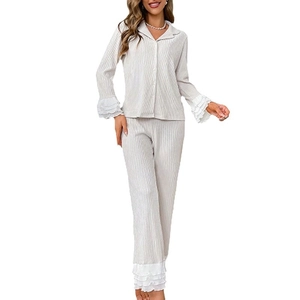 Elegant beige ribbed pajama set for women featuring lapel collar and lace ruffled edges