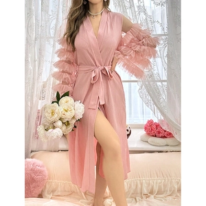 Detail of pink lounge robe featuring layered ruffle sleeves and pleated texture fabric