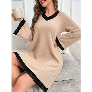 Elegant beige V-neck knitted nightdress with black lace trim in a cozy home setting